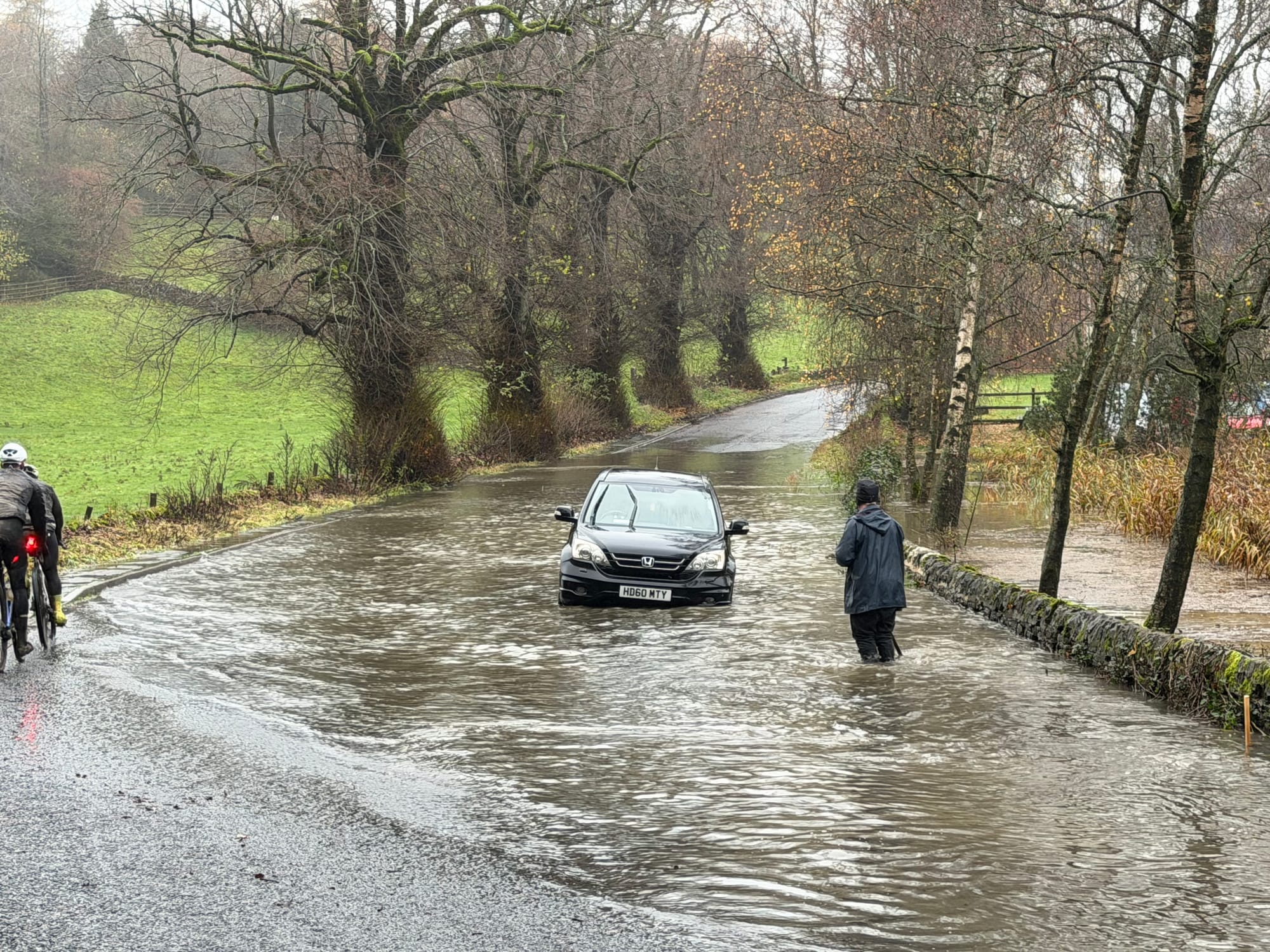 A car stuck in a flooded road