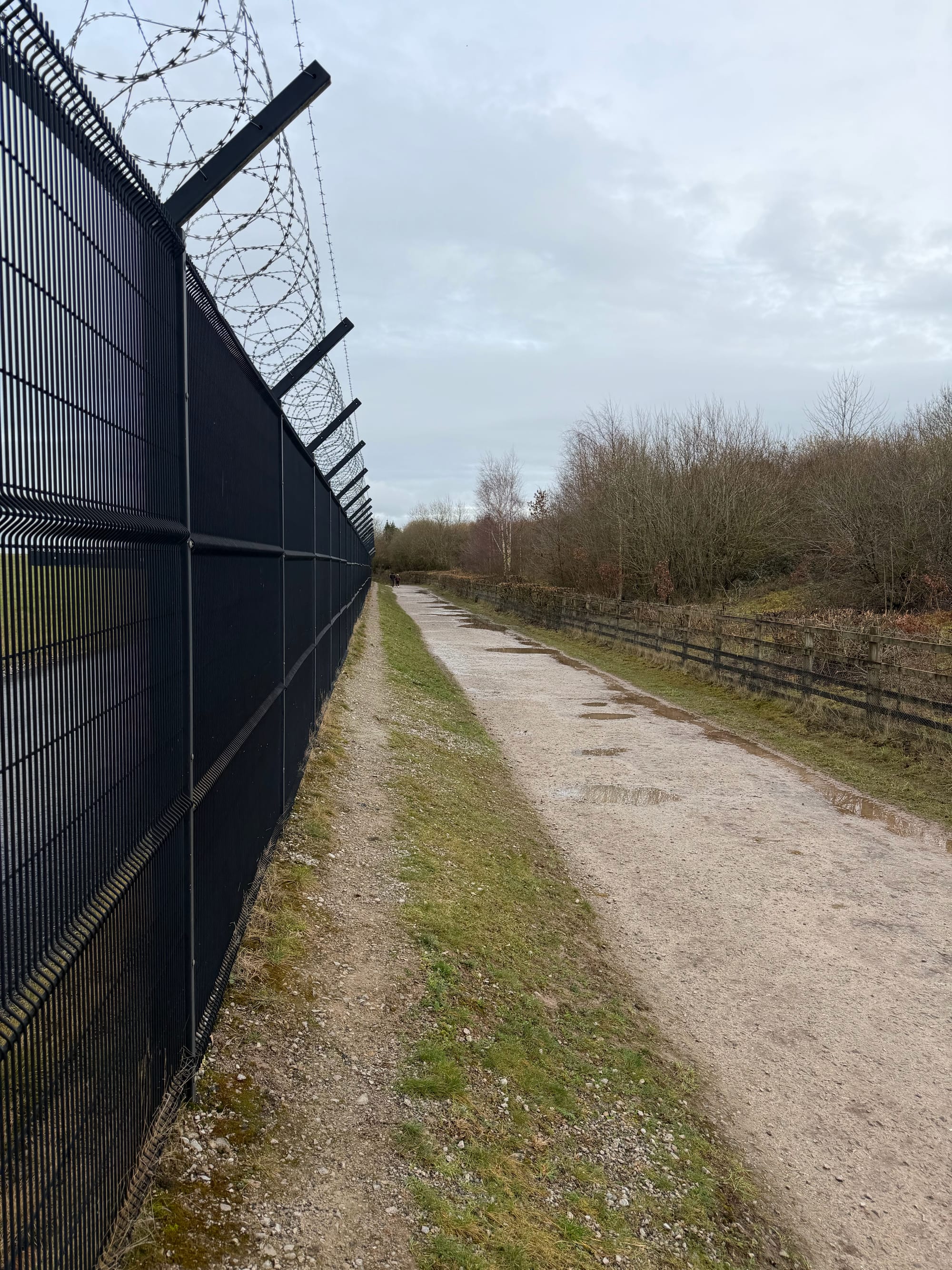 Along the Manchester Airport runway fence.